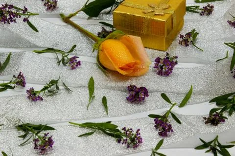 Abstraction of small violet flowers on a silver ribbon Stock Photos