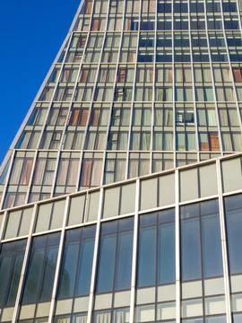 Abstraction from walls and windows. Buildings of unusual shape. Stock Photos