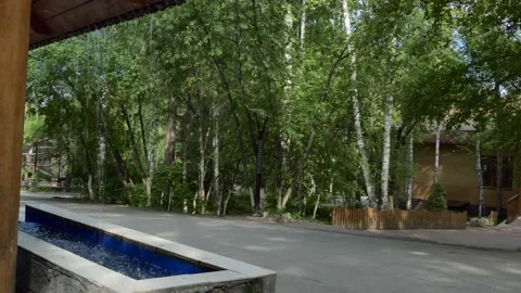 An abstraction. Water drops fall and fill the small pool with water. Stock-Footage 155472065