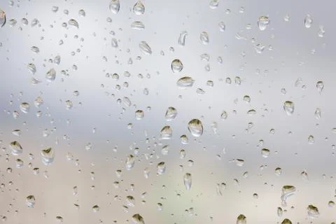 Abstruct drops of rain on a window glass Stock Photos