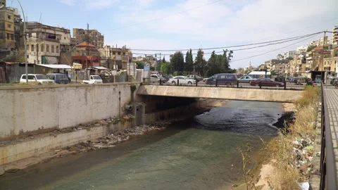 The Abu Ali River running through the city of Tripoli, Lebanon Stock Footage 254181667