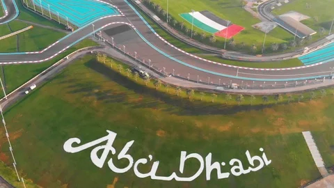 Abu Dhabi and UAE Flag on Grass Stock Footage 129482751