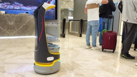 Abu Dhabi, UAE - 25th april, 2025: Robot Serves Water at Abu Dhabi Airport .. Video stock 315495384