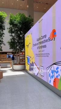 Abu Dhabi, UAE - August 1, 2023: Modern Apple Store advertises Pro 15 Stock Photos