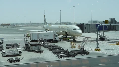 Abu Dhabi, UAE - May 15, 2024 - Etihad Airways Airbus A321 being loaded Stock Footage 290777197
