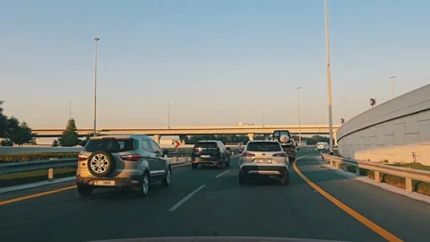 Abu Dhabi, United Arab Emirates - 06/13/2024: Traffic navigates through Stock Footage 278035534