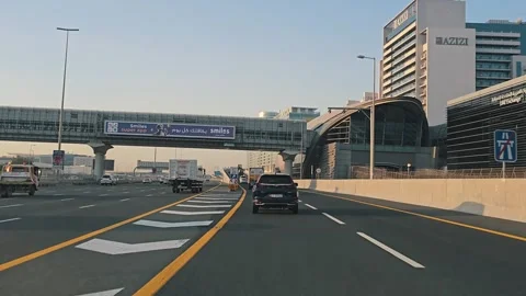 Abu Dhabi, United Arab Emirates - 06/13/2024: Traffic navigates through Stock Footage 278035587