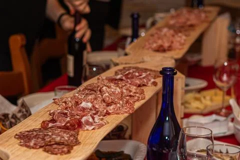 Abundant Spread Featuring Long Serving Board of Salami Crudo and Soppressat.. Stock Photos