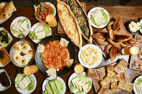Abundant Wooden Table With Array of Delicious Food Foto stock