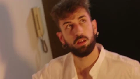 Abuse, alcohol - young drunk man staggers back into the house Stock Footage 197818234
