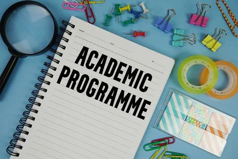 Academic Programme text with magnifying glass on blue background Stock-Fotos