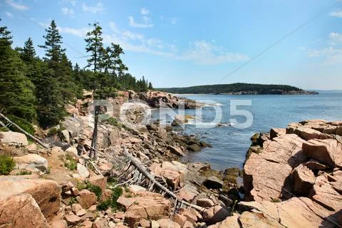 Acadia rocky coast in maine with blue sky Stock Photos