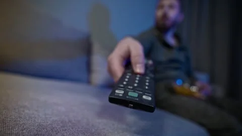 Accelerated Evening Scene of a Man Relaxing With Snacks and Television Vídeo Stock 342352900