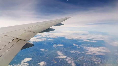 Accelerated flight above the clouds, view from the eluminator on the wing of Stock Footage 127530685