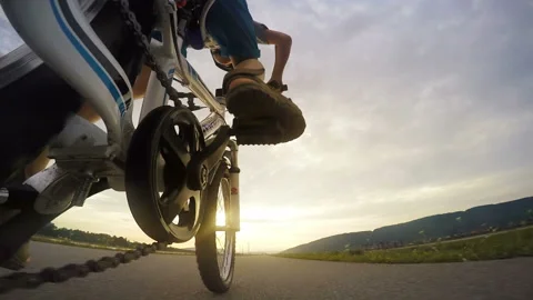 Accelerated footage action camera attached to bicycle child pedalling fast 스톡 동영상 150989577