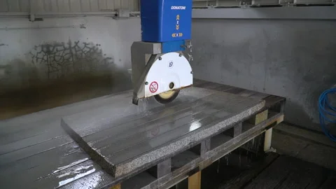 Accelerated footage of CNC machine cutting granite into slabs Stock Footage 237340221