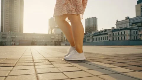 Accelerated steps of a girl walking down the street in the city. Stock Footage 223962380