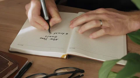 Accelerated time. Hand writing goals for the next year Stock Footage 259823992