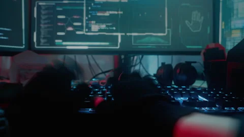 Accelerated video of male hacker typing on keyboard at night Stock Footage 257383956