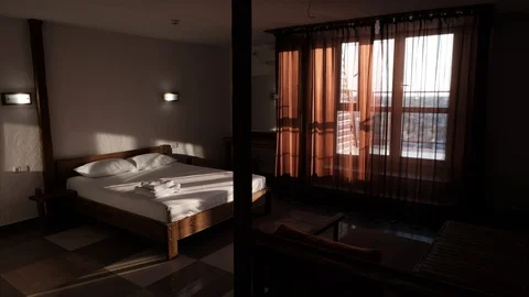 An accelerated view of the comfortable hotel room, through which rapidly comes Stock Footage 91332228