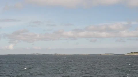 An accelerated view from a ship with small islands going by Stock Footage 55724361