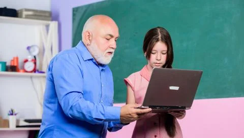 Accelerating into the future. teacher help school girl. school shopping online Stock Photos