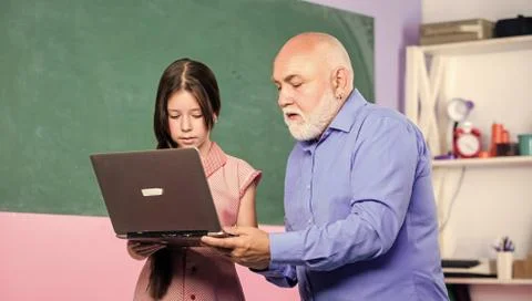 Accelerating into the future. teacher help school girl. school shopping online Stock Photos