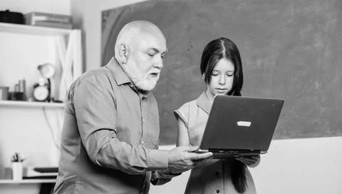 Accelerating into the future. teacher help school girl. school shopping online Stock Photos