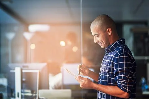 Accelerating straight to success with technology in hand. a young designer Stock Photos