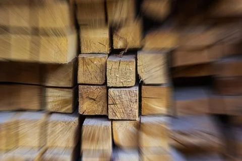Acceleration abstract wooden background group of beams among blurry building Stock Photos
