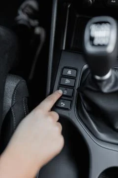Acceleration system of a car with woman's hand Stock Photos