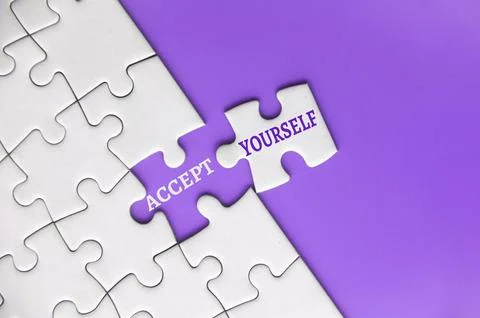 Accept yourself text on missing jigsaw puzzle. Motivational concept Stock Photos