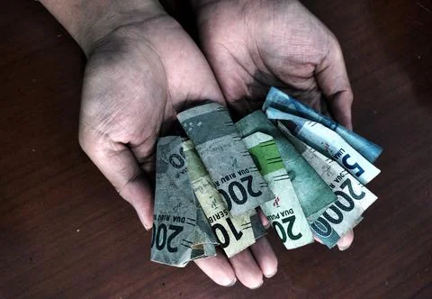 Accepting some banknotes Stock Photos