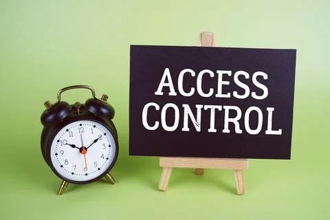 Access Control text with easel and alarm clock on green background Foto stock