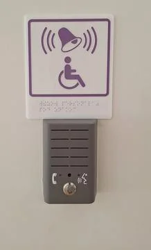 Accessibility intercom with braille and assistance bell icon for disabled Stock Photos