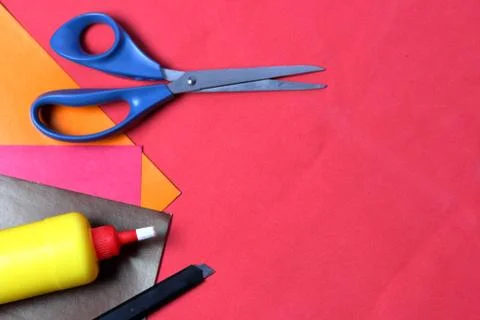 Accessories for application. Scissors, knife, color paper, pencil and ruler.  Stock Photos