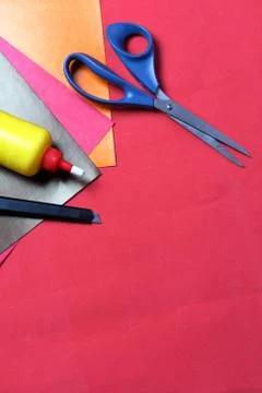 Accessories for application. Scissors, knife, color paper, pencil and ruler.  Stock Photos