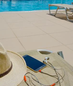 Accessories on the background of the blue pool. Stock Photos