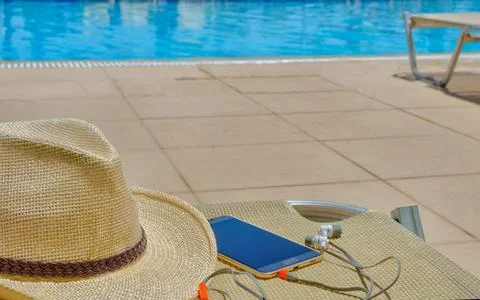 Accessories on the background of the blue pool. Stock Photos