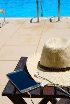 Accessories on the background of the blue pool. Stock Photos