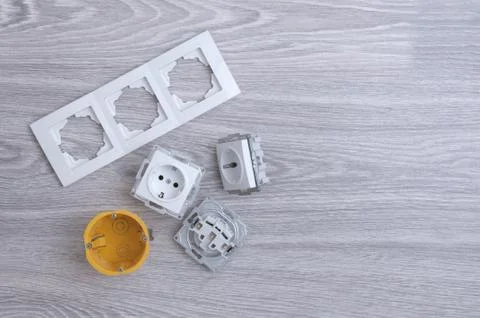 Accessories for the installation of sockets. Triple socket on the floor. Foto stock