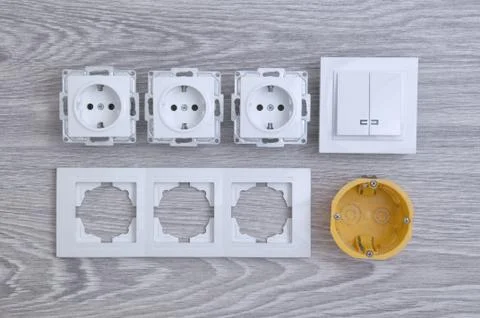 Accessories for the installation of sockets. Triple socket on the floor. Stock Photos