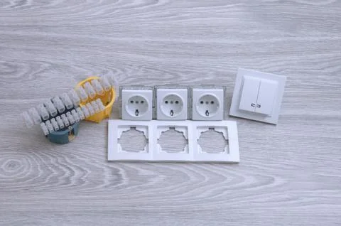 Accessories for the installation of sockets. Triple socket on the floor. Stock Photos