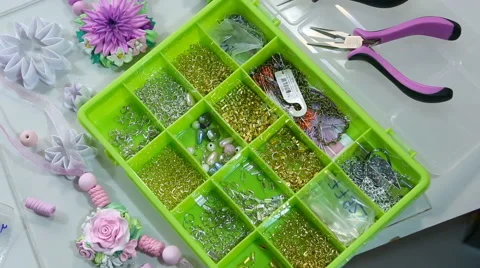 Accessories for needlework in container and tools for creating fashion jewelr Stock Footage 61513924