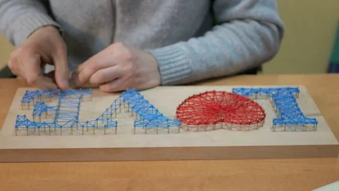 Accessories for needlework on wooden table. Stock Footage 73802409