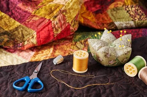 Accessories for patchwork on a quilt Fotos de archivo