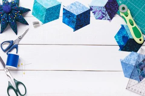 Accessories for patchwork top view on a white wooden surface Stock-Fotos