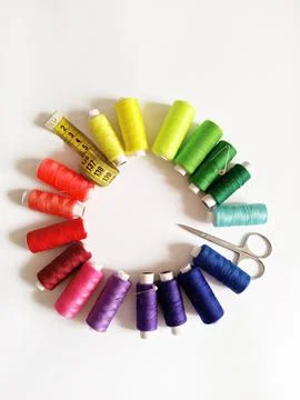 Accessories for sewing. colored threads, centimeter, scissors, needle, pin Stock Photos