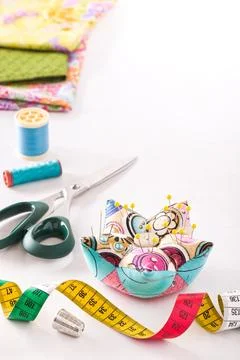 Accessories for sewing on a white surface Stock Photos