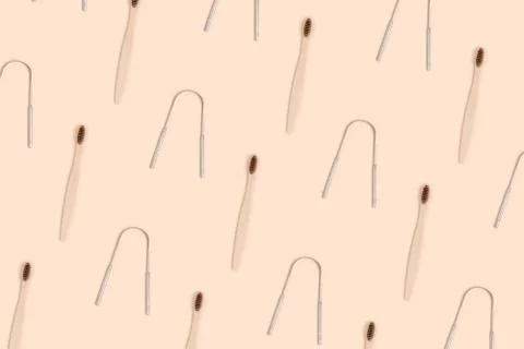 Accessories for tooth hygiene pattern on a beige background. Stock Photos